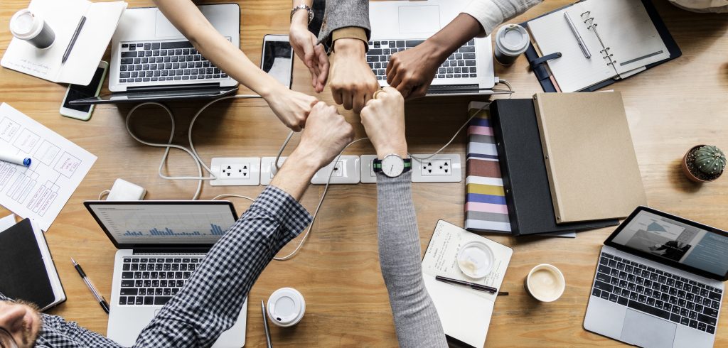 Colleagues giving fist bump